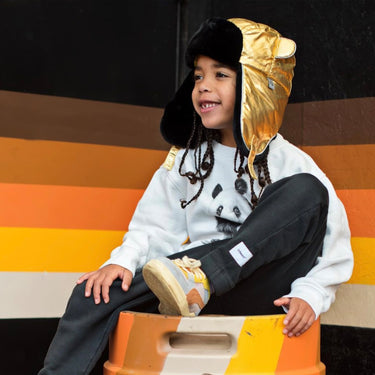 Kid wearing gold metallic winter trapper hat (Image #7)
